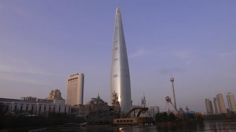 Evening panorama on Lotte World Tower and empty Adventure Park, Seoul, South Stock Footage 94369087
