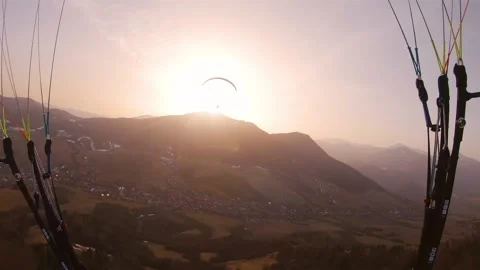 Evening paragliding flight to the sun at sunset Freedom Adrenaline flying Stock Footage 151348287