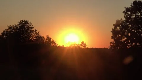 Evening Partial Solar Eclipse Viewed Over Mountain Tree Line Video stock 343845490