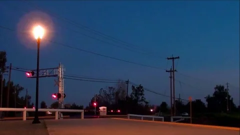 Evening Passenger Train Coming Into Station Stock Footage 81169044