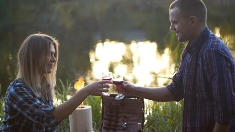 Evening picnic with fire and vine Stock Footage 81756467