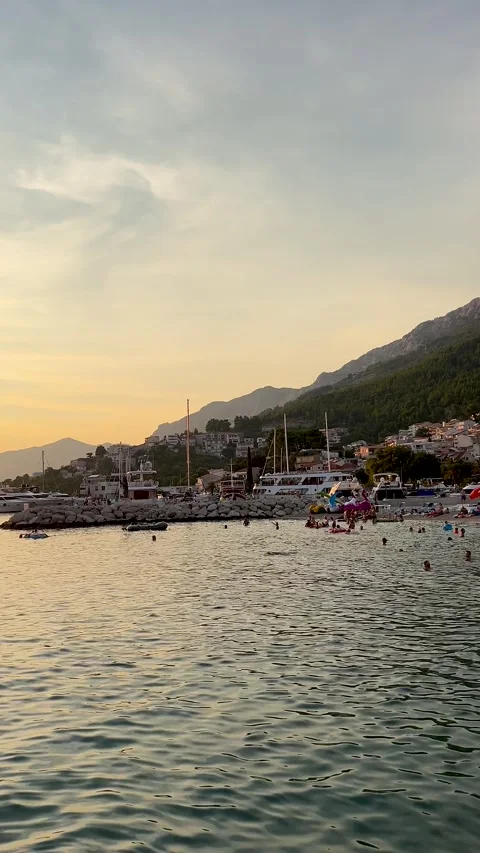 Evening Quiet beach against the backdrop of beautiful picturesque mountains Stock Footage 303691183