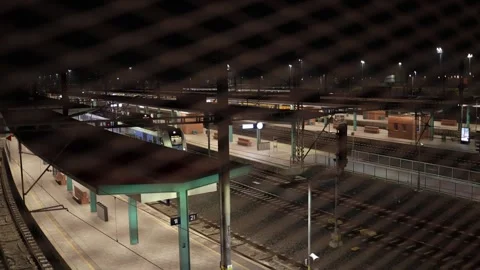 Evening railway station with train at platform preparing for departure and calm  Stock Footage 323265881
