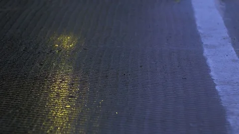 Evening rain drips onto the concrete surface Stock Footage 78067262