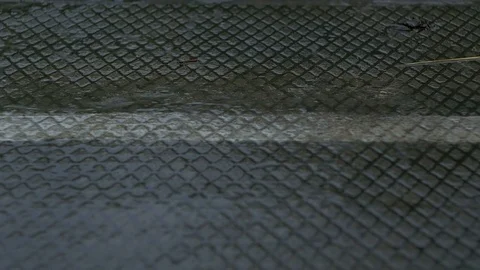 Evening rain drips onto the concrete surface Stock Footage 78068869