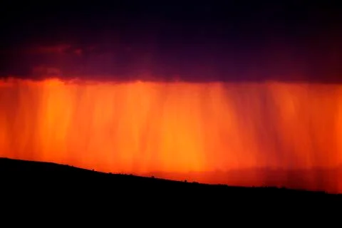 Evening Rainstorm at Sunset Stock Photos