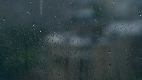 Evening Rainy landscape behind window glass. rein drops Video stock 312376807