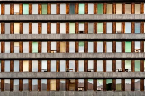 Evening reflections on small aligned windows. Stock Photos