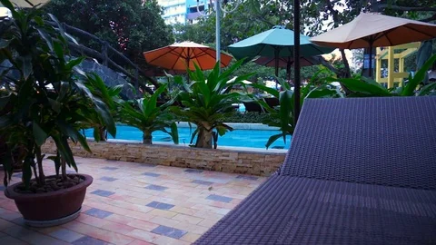 The evening at the resort. Empty sun lounger by the pool. Stock Footage 70747101