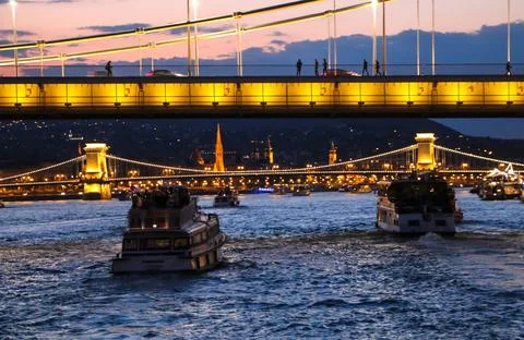 Evening river boat trip in Budapest, Hungary, beautiful evening city lights Stock Photos