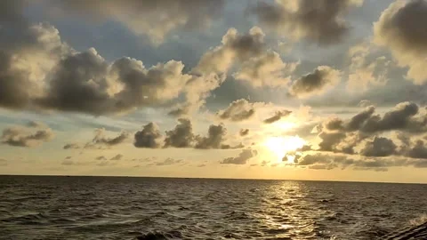 Evening River Sunset Time Lapse with Dramatic Clouds and Distant Boat Stock Footage 342630771