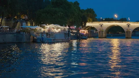 Evening Riverside Dining in Paris Stock Footage 263842171