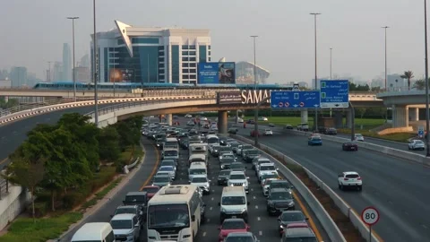 Evening rush-hour congestion on the road connecting Dubai and Sharjah Stock Footage 345626651