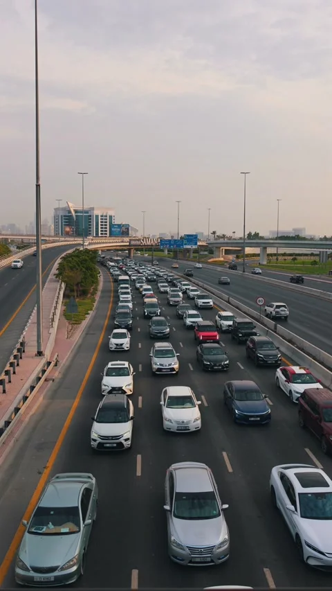 Evening rush-hour congestion on the road connecting Dubai and Sharjah 動画素材 345626747
