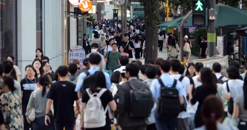 Evening rush hour, crowd of office workers walking on sidewalk in Gangnam, Seoul Stock Footage 295029543