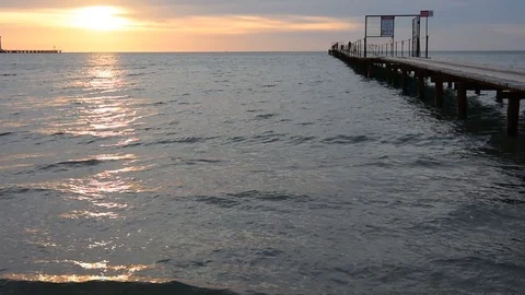 Evening sea sunset, on the right side of the pier Stock Footage 127570408