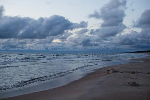 Evening seascape with clouds and waves. Dramatic Seascape. Stock Photos