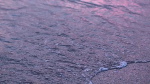 Evening seashore with wave close up. Calm night ocean water waves splashing Stock Footage 276611657