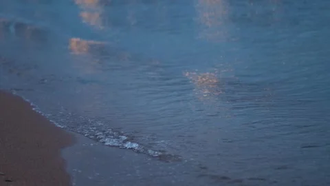 Evening seashore with wave close up. Calm night ocean water waves splashing Stock Footage 280228969