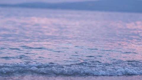 Evening seashore with wave close up. Calm night ocean water waves splashing Stock Footage 282083054