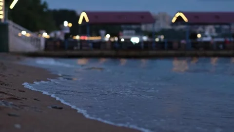 Evening seashore with wave close up. Calm night ocean water waves splashing Stock Footage 287185507