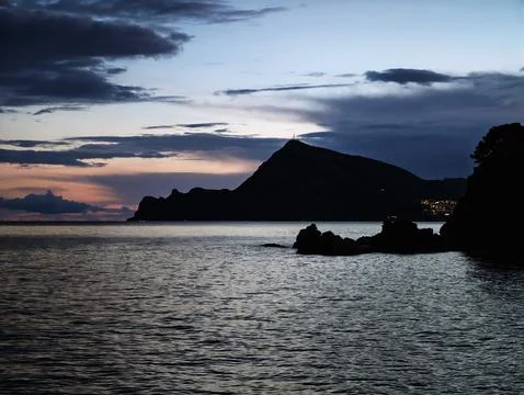 Evening serene view, Calm bay under cloudy sky, Peaceful sunset scene with .. Fotos de archivo
