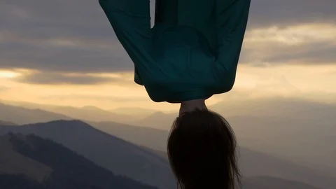 Evening shot of anti-gravity yoga Stock Footage 88624799