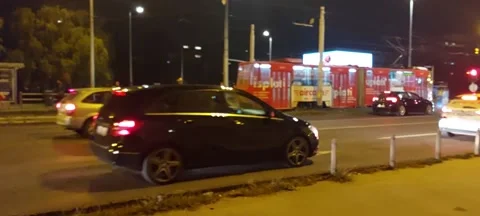 Evening shot at a very busy intersection with tramways and cars Stock Footage 218317878