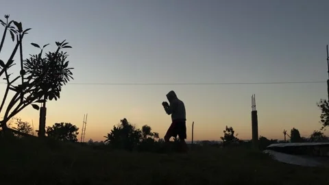 Evening Silhouette Spinning Kick Practice Stock Footage 337916689