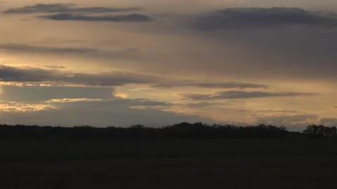 Evening sky and clouds over the field, rural landscape in a dark tonality. Stock Footage 134239505