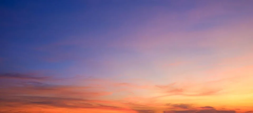 Evening sky background after sundown with dramatic dusk clouds and colorful.. Stock Photos