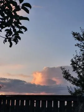 Evening sky with bright cumulus cloud weather change concept Stock Photos