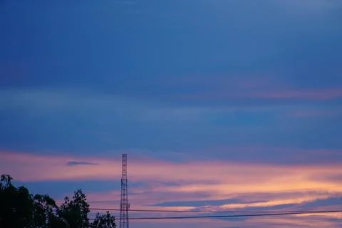 The evening sky with clouds at sunset in the beginning of the night. twilight Stock Photos