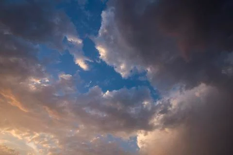 Evening sky with colorful rain clouds Stock Photos