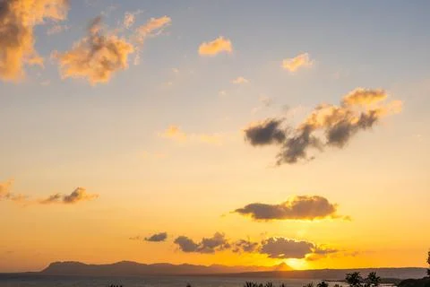 Evening sky with dramatic clouds over the sea. Dramatic sunset over the sea. Stock Photos