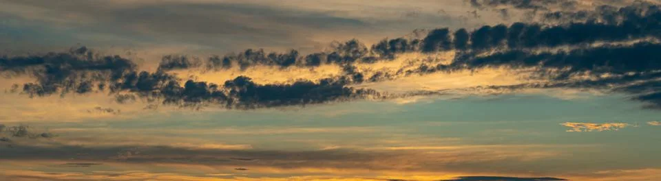 Evening sky with dramatic clouds over the sea. Dramatic sunset over the sea Stock Photos