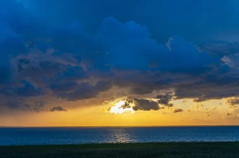 Evening Sky with Dramatic Clouds Over the Lake. Dramatic Sunset Over the La.. Stock Photos