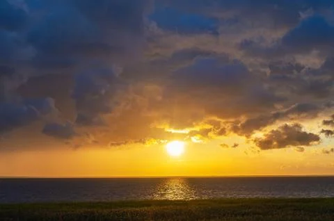 Evening Sky with Dramatic Clouds Over the Lake. Dramatic Sunset Over the La.. Stock Photos