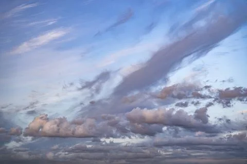 Evening sky with dramatic clouds. the sky with clouds of unusual shape Stock Photos