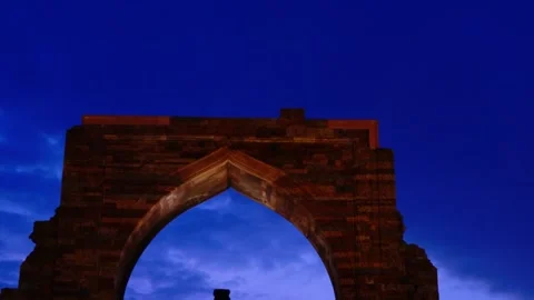 In Evening Sky Flight Soaring with Twinking Lights over Qutub Minar's Entrance. Stock-Footage 263972422