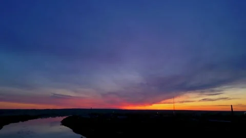 Evening sky industrial silhouette in dramatic Baltic drone shot Stock Footage 308364447