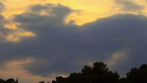 Evening sky on the island of Mallorca. Accelerated video. Rays of the setting Stock Footage 77111786