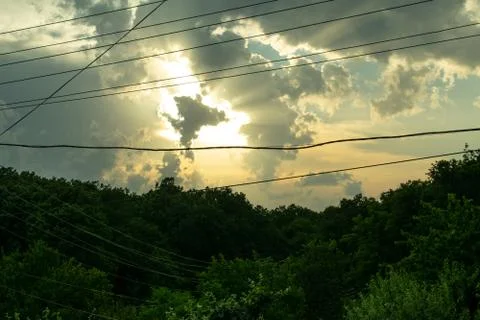 Evening sky over the forest. the clouds have the fom of the dancing angel Stock Photos