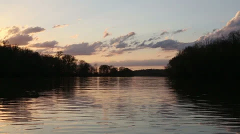 Evening sky over river Stock Footage 22935292