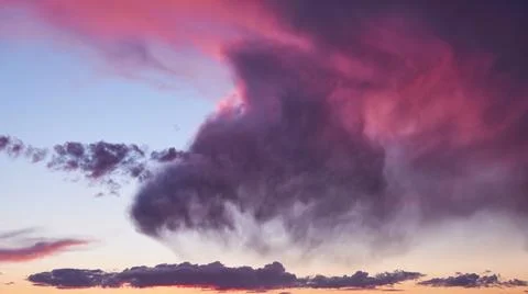 Evening sky with pink clouds at sunset, cloudy timelapse Stock Photos
