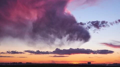 Evening sky with pink clouds at sunset, cloudy timelapse Stock Photos