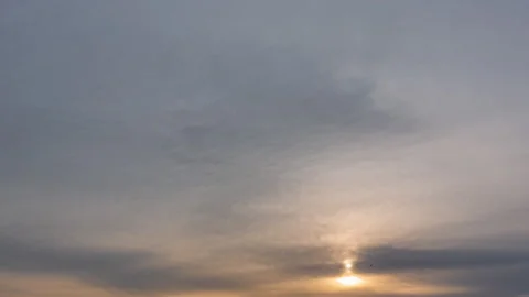 Evening sky.  Sun rays emerge through the clouds. Video stock 250443240