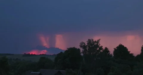 Evening sky thunderstorm lightning over field and village an impending storm Stock Footage 132952997