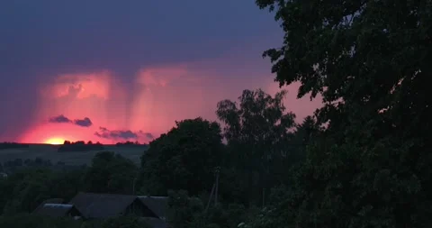 Evening sky thunderstorm lightning over field and village an impending storm Stock Footage 132953004