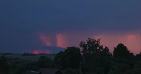 Evening sky thunderstorm lightning over field and village an impending storm Stock Footage 132953007